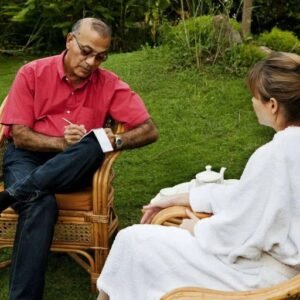 Personalized Guidance IVAC’s Ayurvedic doctor consulting with a guest, providing personalized guidance and tailored treatment plans to support a balanced lifestyle.