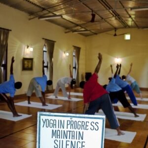 Mindful Practices Guests participating in a yoga session in IVAC’s serene indoor yoga hall, designed to foster inner balance and tranquility through mindful movement and meditation.